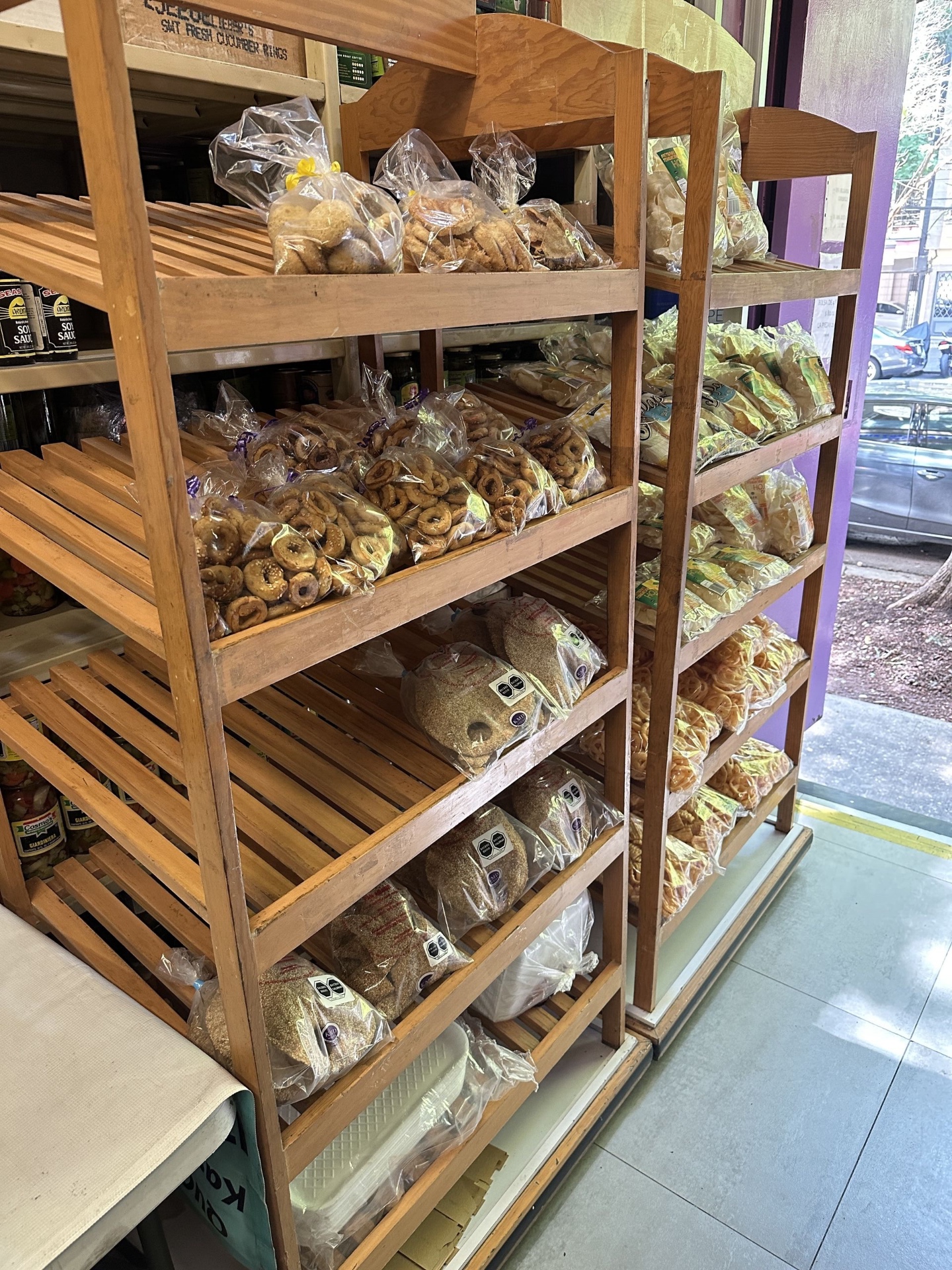 Bakery shelves with cookies, bagels, and breads