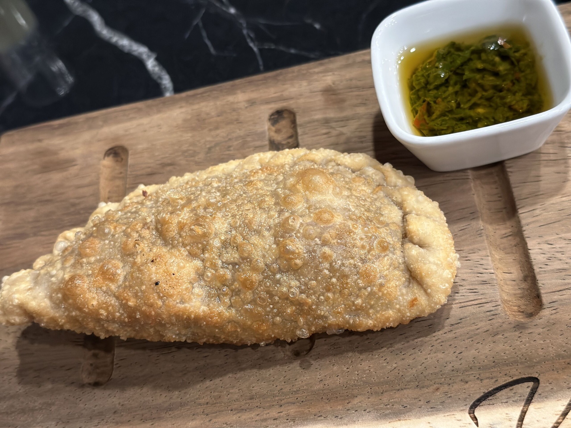 Empanada with chimichurri
