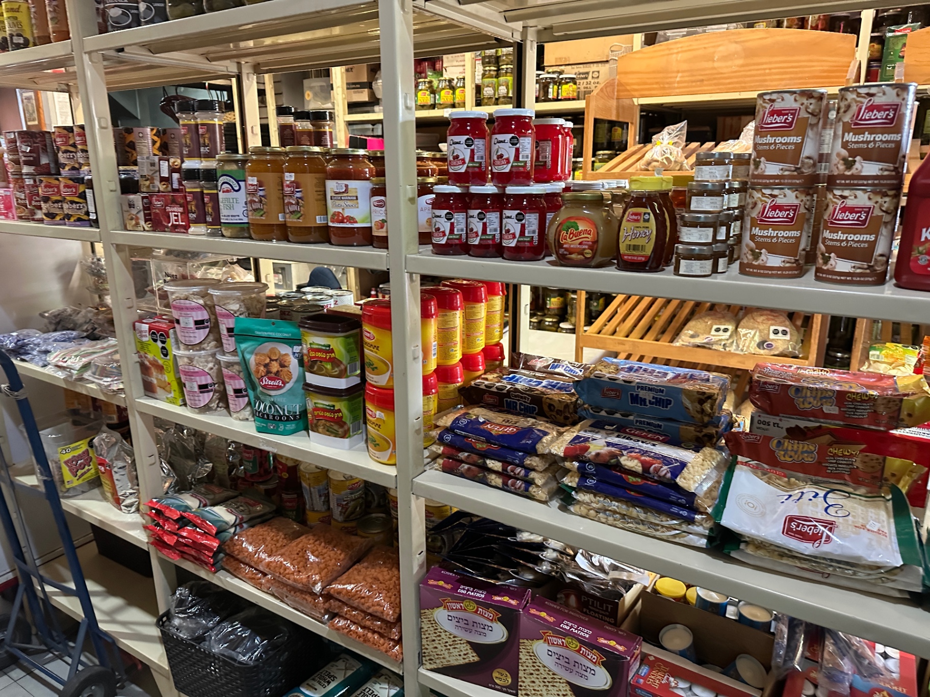 Kosher pantry aisle stacked with imports