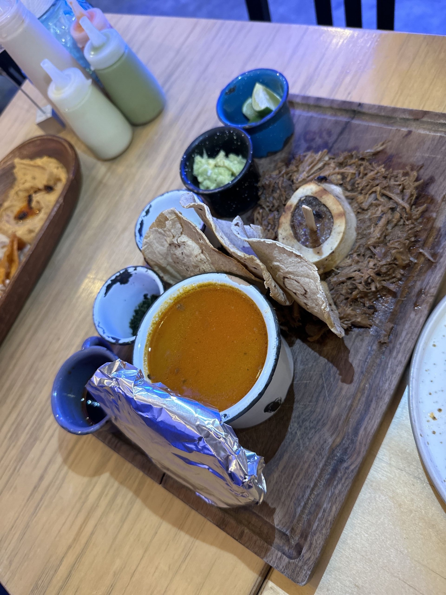 Shredded beef with marrow bone and tortillas