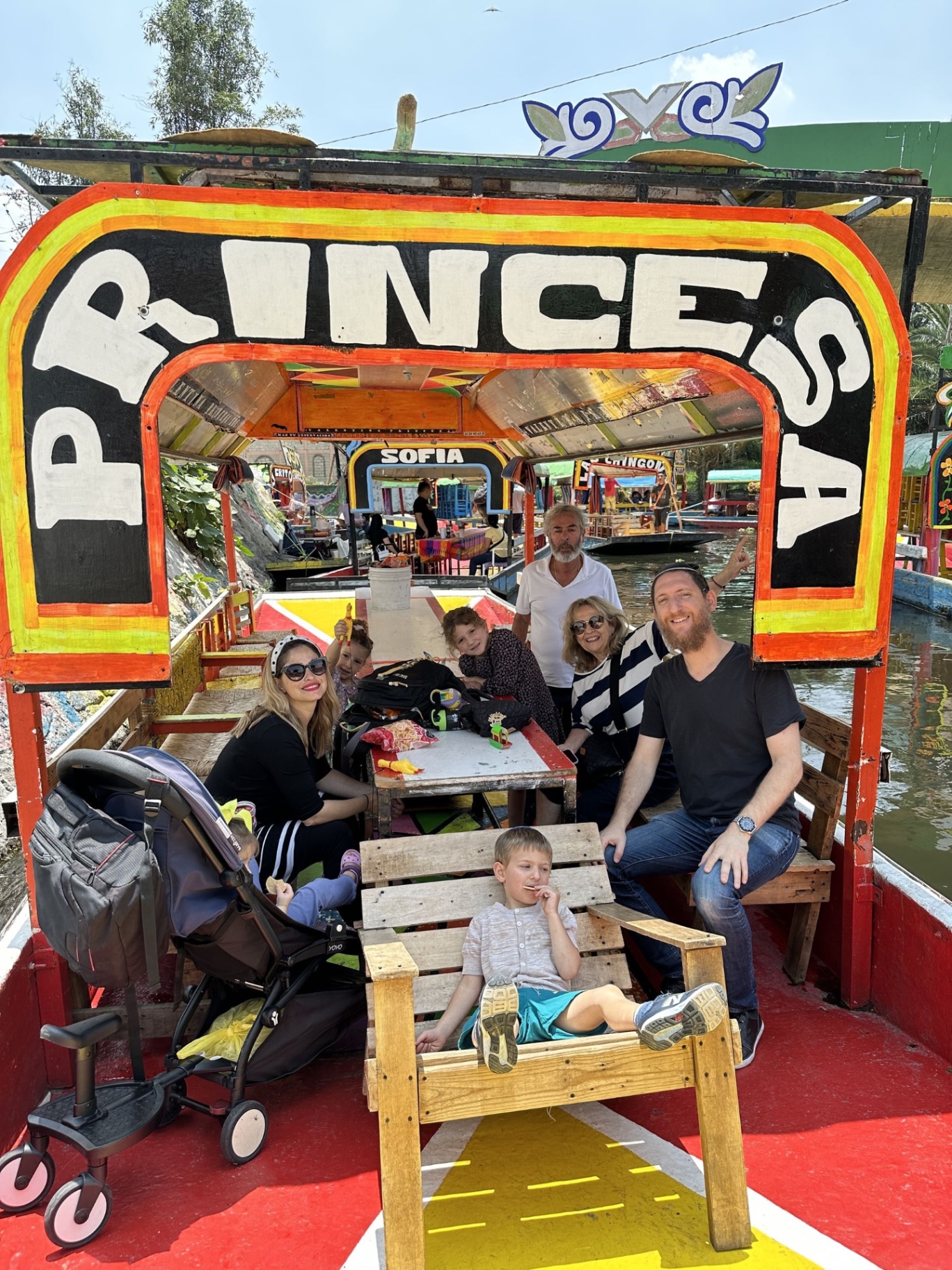 Family aboard a trajinera in Xochimilco